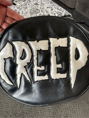 Black Round Leatherette Bag with Large White 'CREEP' Patch